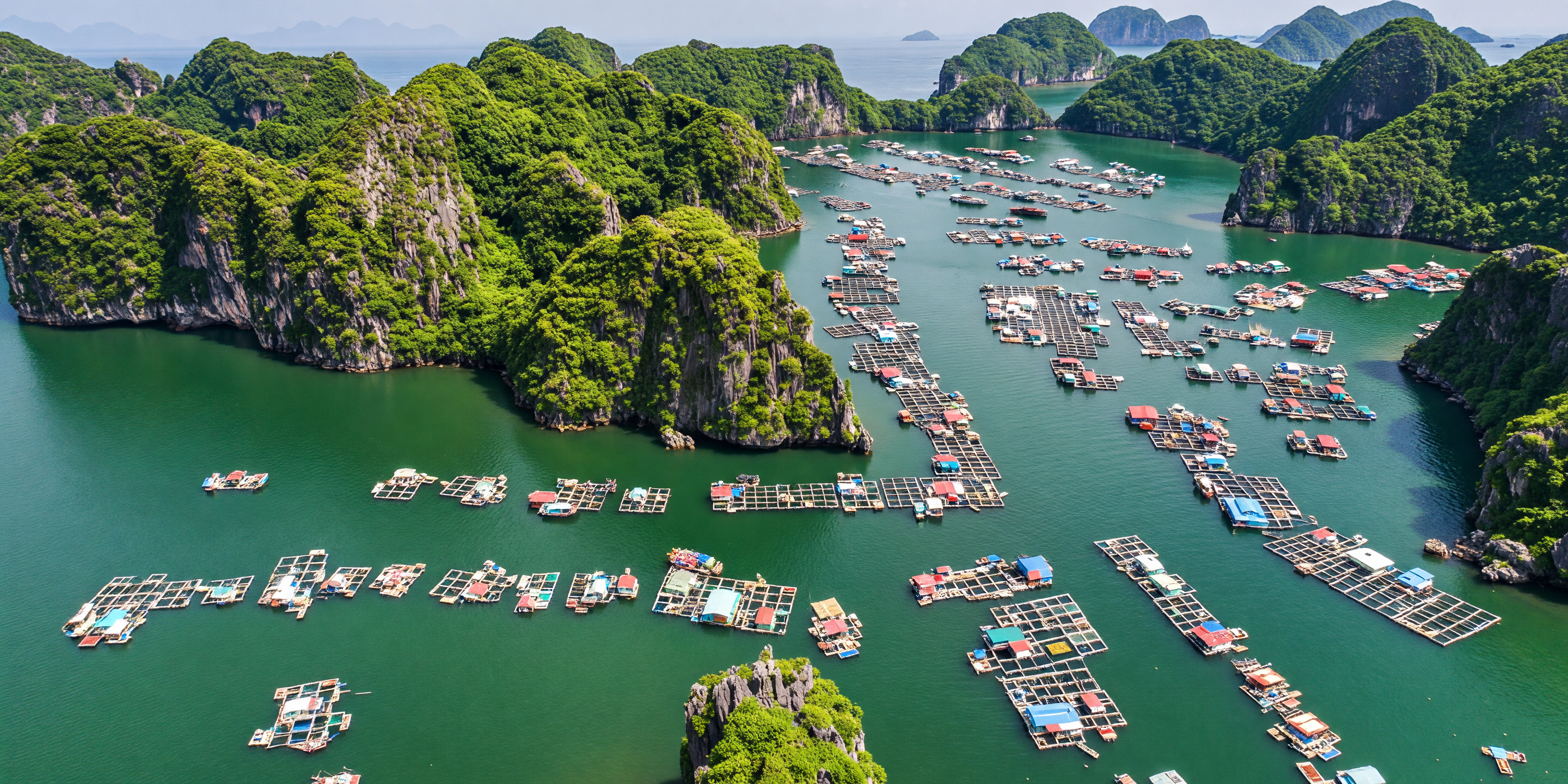Floating fishing village with colourful boats in Ha Long Bay